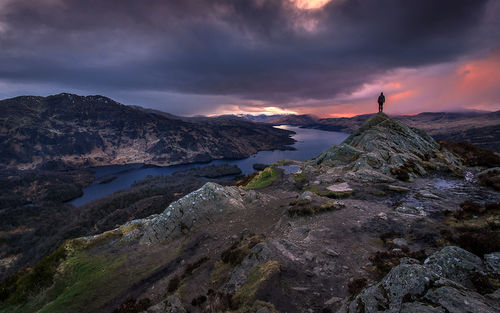 Scenic view of mountains against cloudy sky