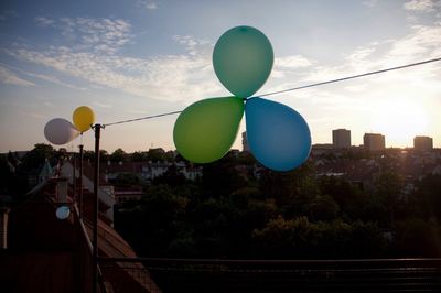 Low angle view of balloons against sky