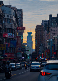 Traffic on city street at dusk