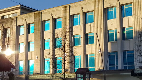 Low angle view of building against blue sky