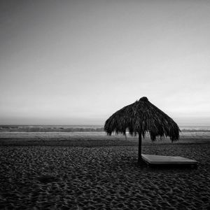 Thatched roof at calm beach