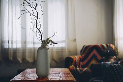 Close-up of vase on wooden table