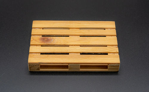 High angle view of piano on table against black background