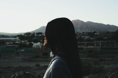 Woman looking at mountain landscape