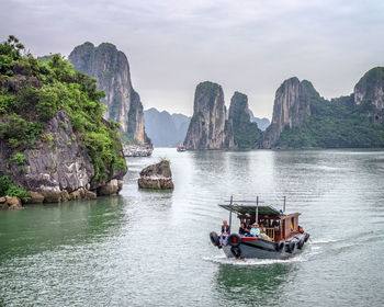 People traveling in boat on ha long bay