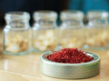 Close-up of strawberries in jar on table