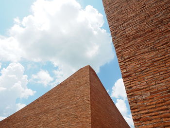 Low angle view of building against cloudy sky