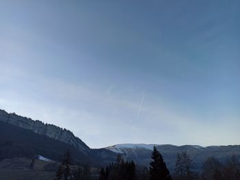 Scenic view of mountains against sky during winter