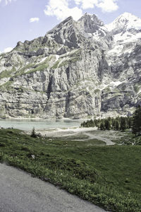 Scenic view of landscape and mountains against sky