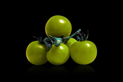 Close-up of apple against black background