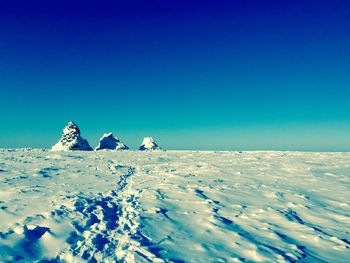 Scenic view of sea against clear blue sky