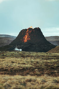 Rock formations on land against sky