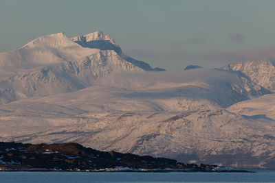 Scenic view of mountains against sky during winter