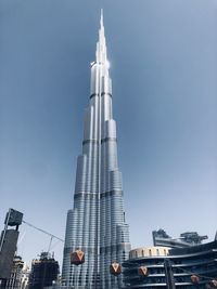 Low angle view of buildings in city against sky