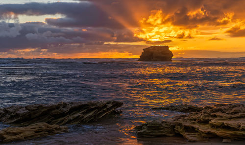 Scenic view of sea against sky during sunset