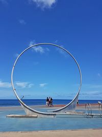 Scenic view of sea against blue sky