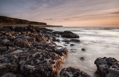 Scenic view of sea against sky during sunset