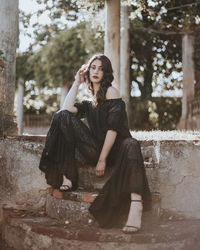 Young woman sitting outdoors