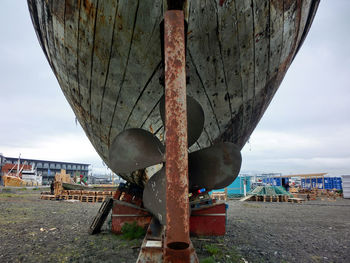 Rusty metallic structure against sky