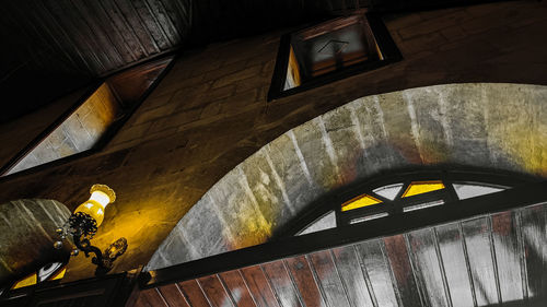 Low angle view of illuminated ceiling in building