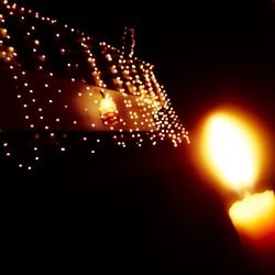 Close-up of illuminated christmas lights at night