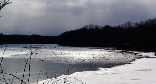 Scenic view of frozen lake against sky