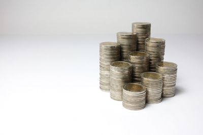 Stack of coin against white background