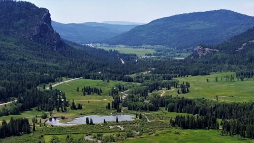 Scenic view of landscape and mountains against sky