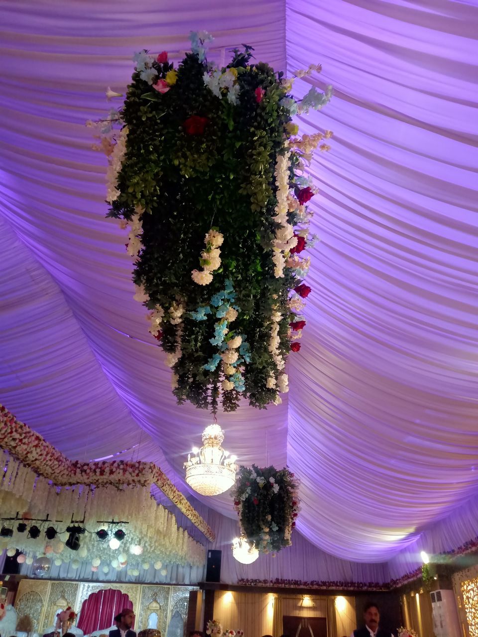 ILLUMINATED CHRISTMAS TREE ON CEILING OF BUILDING