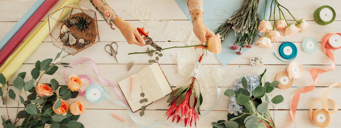 High angle view of various flowers hanging on wall