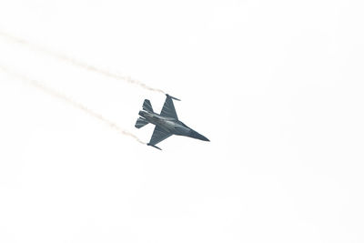 Low angle view of airplane flying in sky