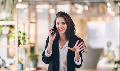 Young woman using smart phone outdoors