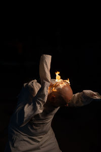 Low angle view of man against black background