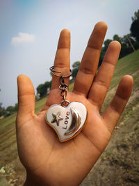 Close-up of hand holding ring