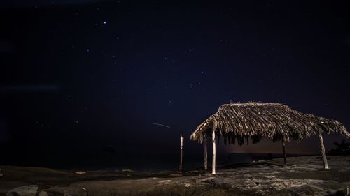 Scenic view of landscape against sky at night