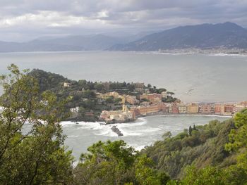 High angle view of townscape by sea