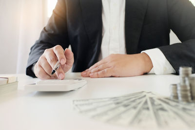 Midsection of man holding table