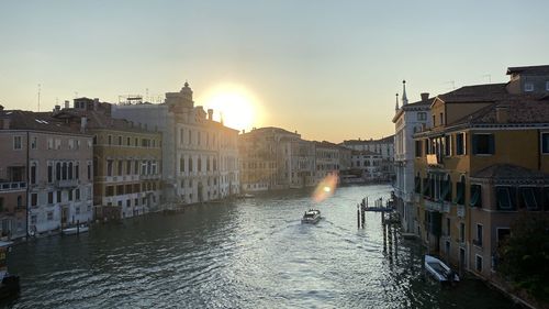 Buildings in city at sunset