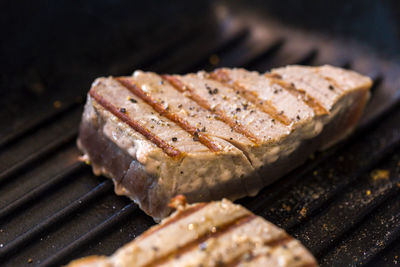 High angle view of meat on barbecue grill