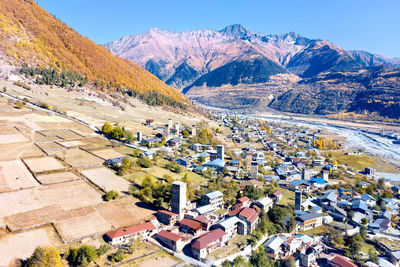 High angle view of buildings and mountains against sky