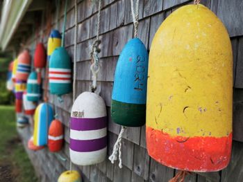 Close-up of multi colored clothes hanging on wall