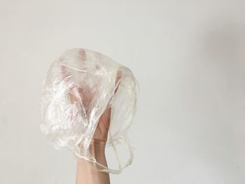 Close-up of woman holding white background