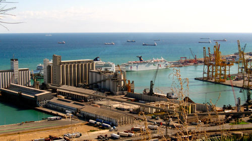 Boats moored at harbor