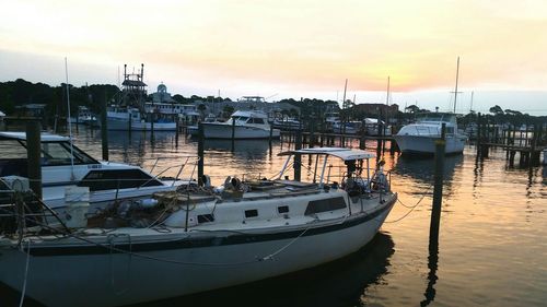 Boats moored at harbor