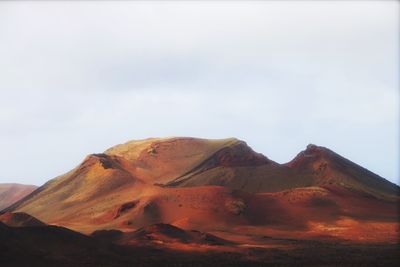 Scenic view of volcanic landscape against sky