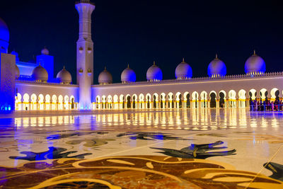 Illuminated building in city at night