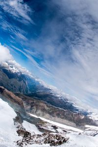 Scenic view of mountains against sky during winter