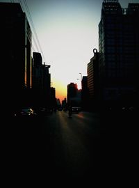 Buildings in city at sunset