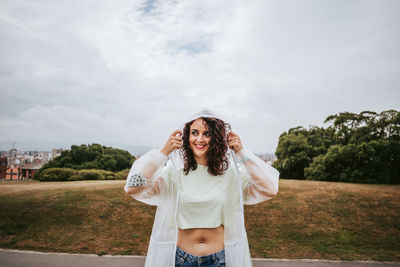 Full length of woman standing against sky