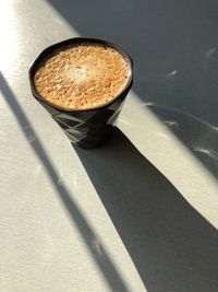 High angle view of coffee cup on table
